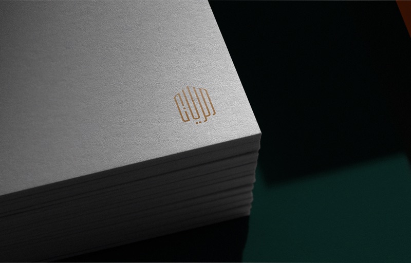 Gold Arabic monogram on textured stationery